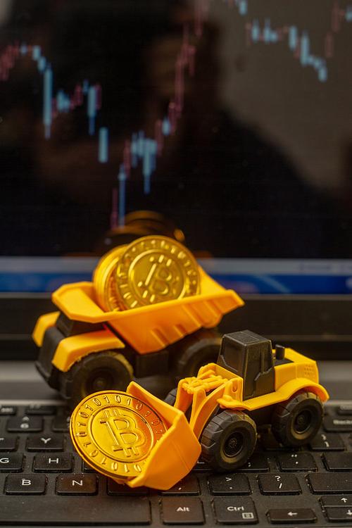 A mining farm worker inspects a row of ASIC miners.